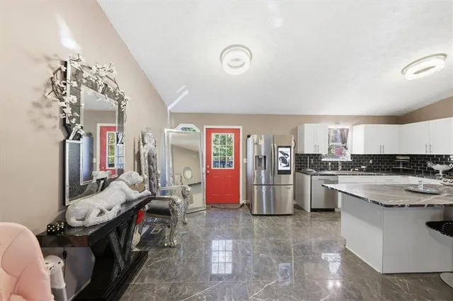 a kitchen with a sink and cabinets