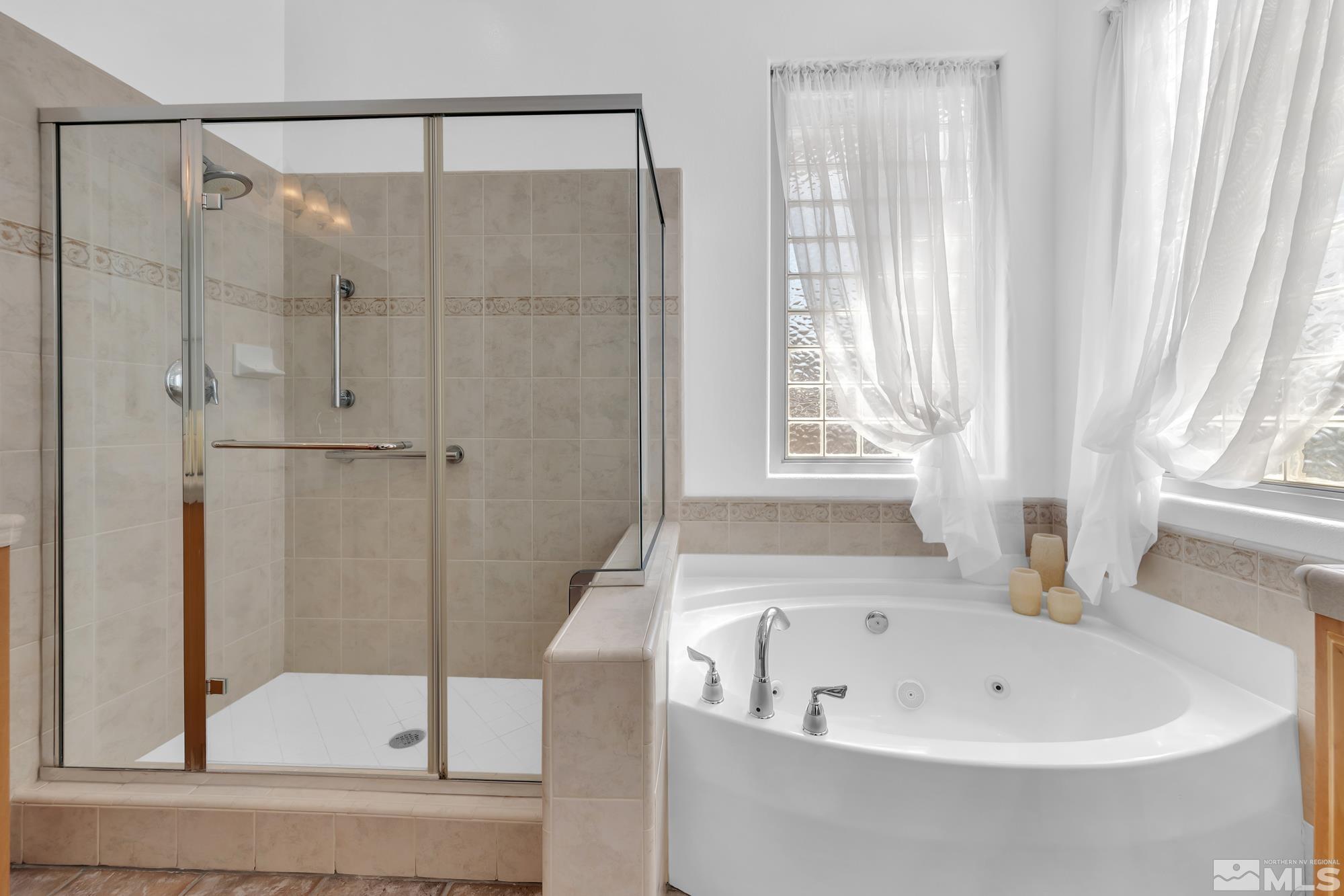 9900 Wilbur May, Unit 3902 Reno, NV 89521 - Photo 22 of 28 a bathroom with a bathtub and shower