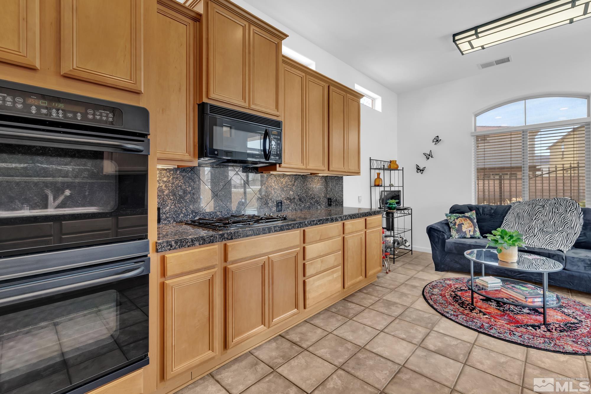 9900 Wilbur May, Unit 3902 Reno, NV 89521 - Photo 6 of 28 a kitchen with cabinets appliances and a counter space