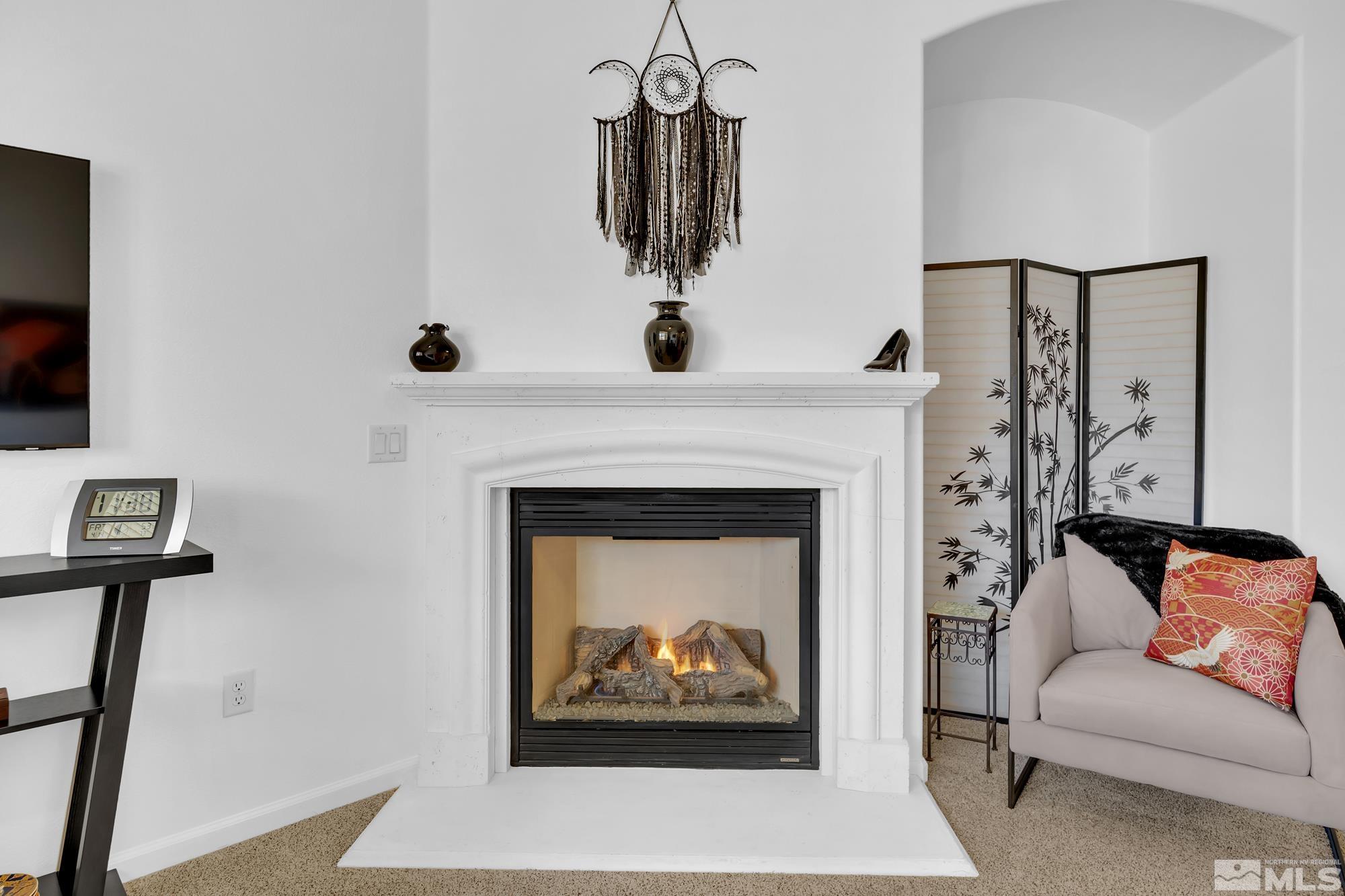9900 Wilbur May, Unit 3902 Reno, NV 89521 - Photo 10 of 28 a living room with furniture and a fireplace