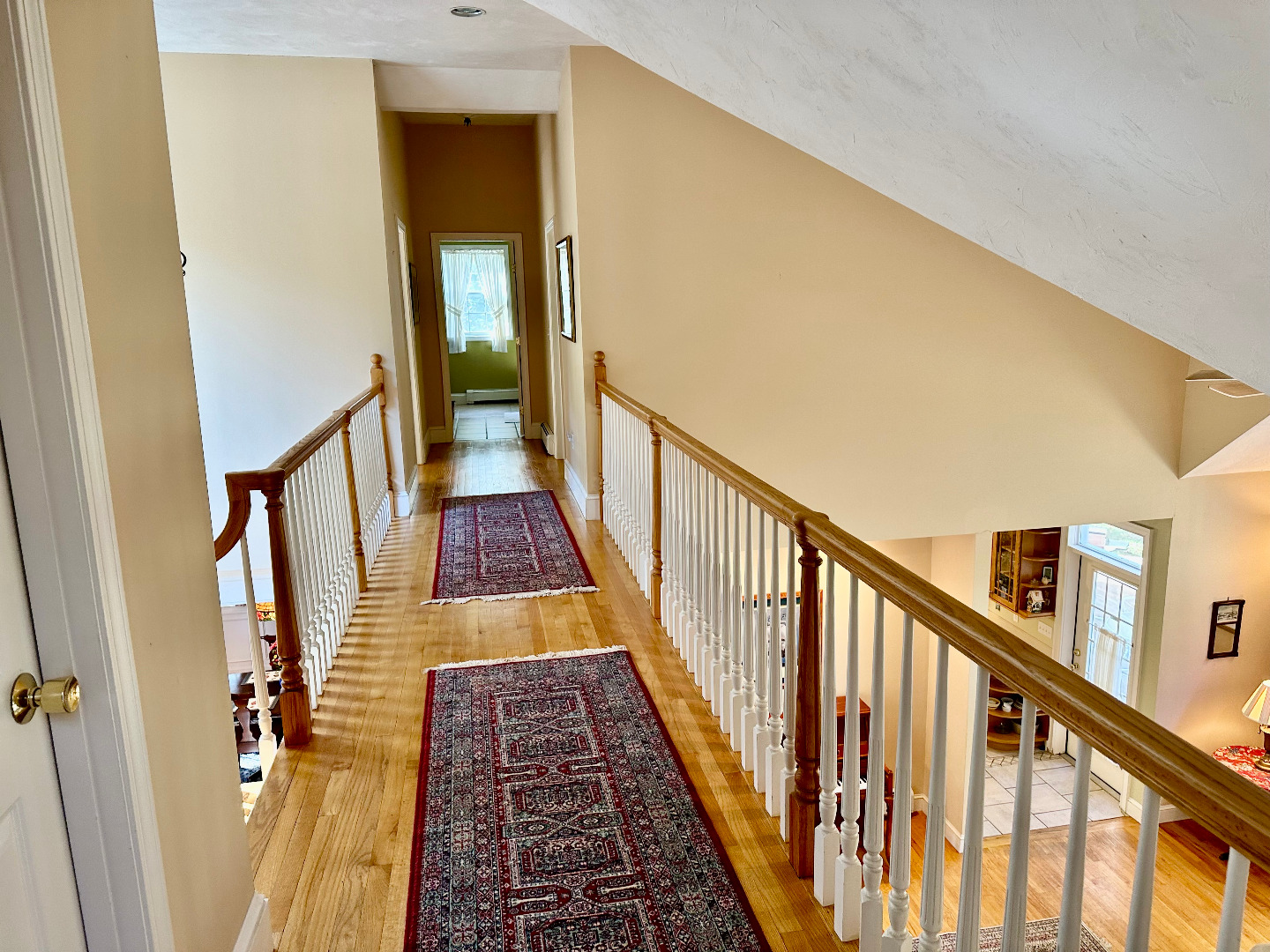 248 Pond Road West Tisbury, MA 02568 - Photo 23 of 34 a view of a hallway with wooden floor and staircase