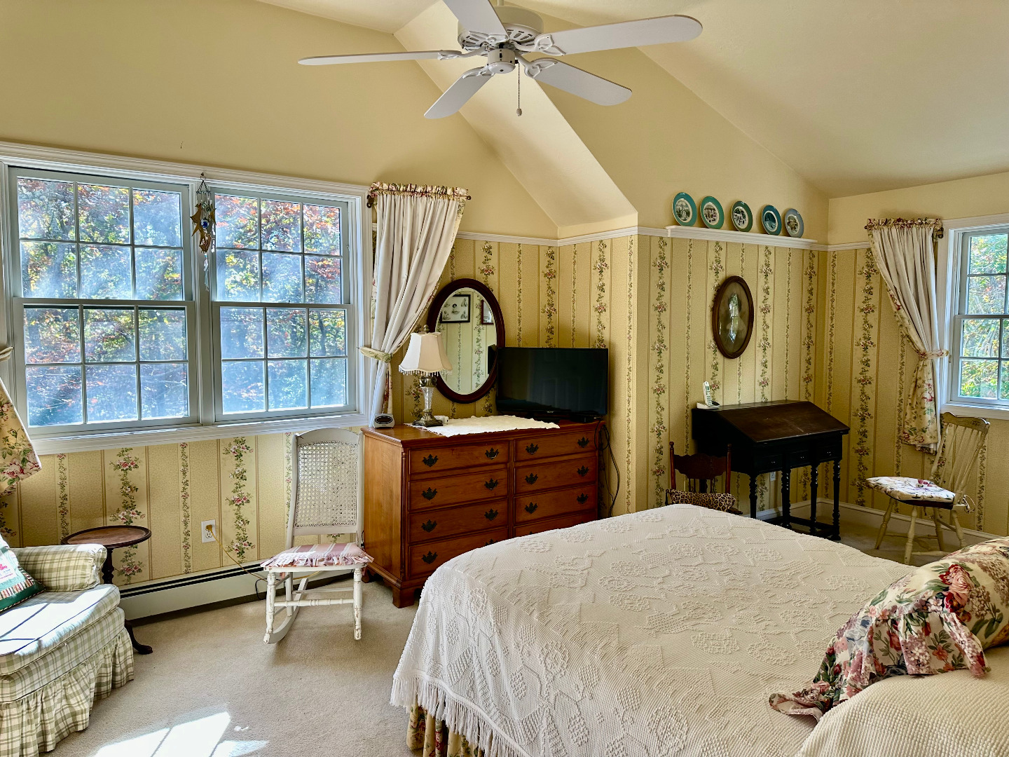 248 Pond Road West Tisbury, MA 02568 - Photo 25 of 34 a bedroom with a bed and a chandelier