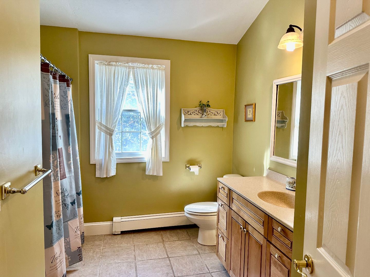 248 Pond Road West Tisbury, MA 02568 - Photo 26 of 34 a bathroom with a granite countertop toilet sink and mirror