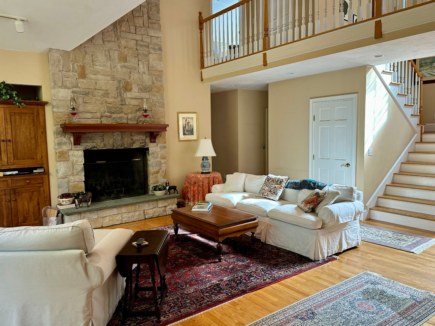 248 Pond Road West Tisbury, MA 02568 - Photo 7 of 34 a living room with furniture a rug and a fireplace