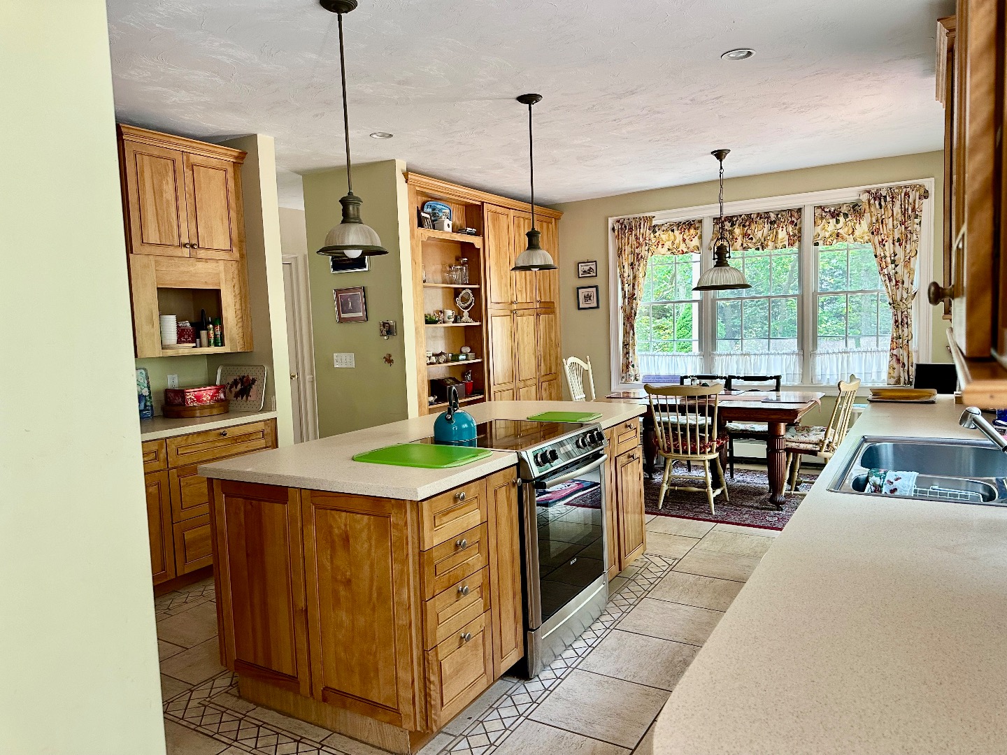 248 Pond Road West Tisbury, MA 02568 - Photo 9 of 34 a kitchen with stainless steel appliances granite countertop a stove a refrigerator and a wooden cabinets