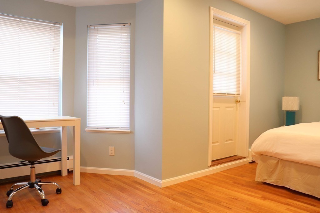 12 Regent Street, Unit 2F Cambridge, MA 02140 - Photo 14 of 29 a view of a workspace with furniture and a window
