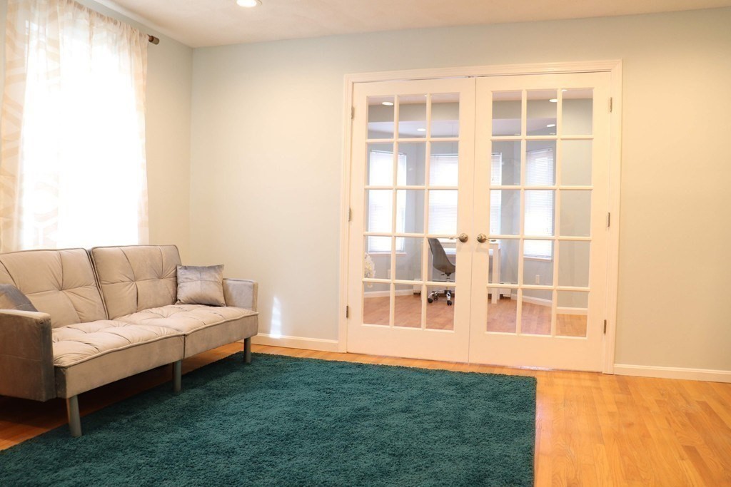 12 Regent Street, Unit 2F Cambridge, MA 02140 - Photo 2 of 29 a living room with a furniture and a window