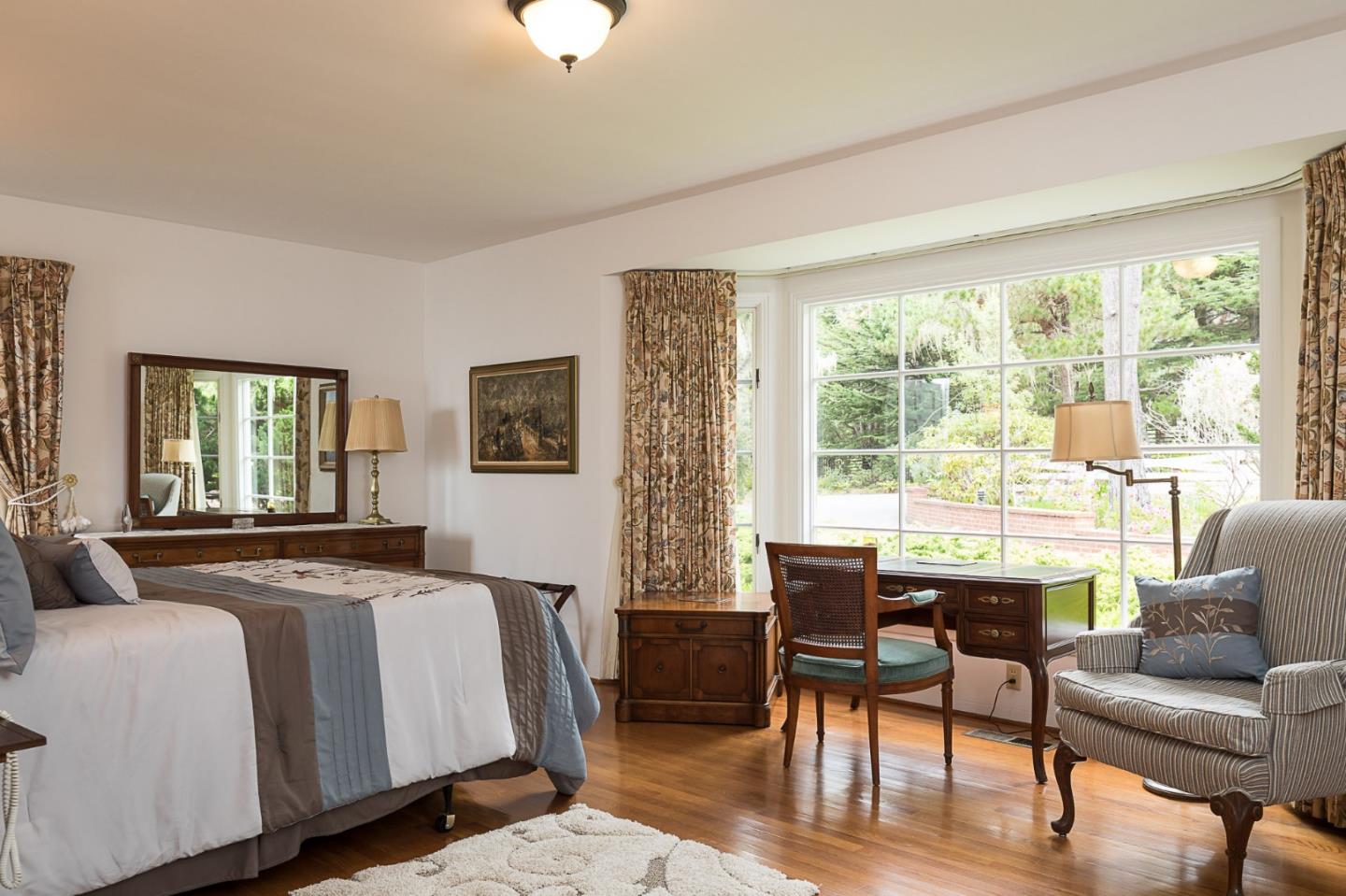 1508 Viscaino Road Pebble Beach, CA 93953 - Photo 11 of 23 a bedroom with a bed and a couch