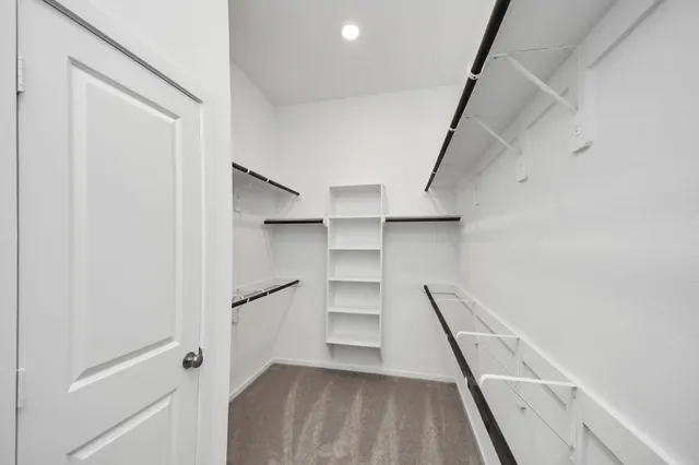 a view of an empty walk in closet