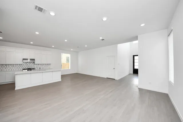 a view of kitchen with center island and stainless steel appliances