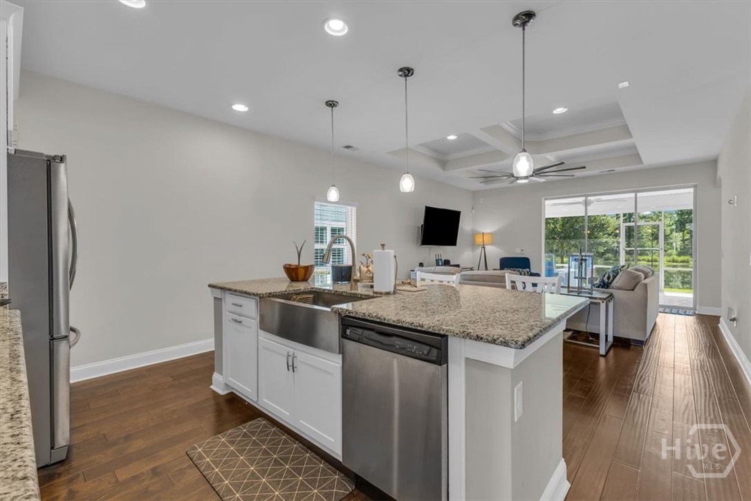 291 McQueen Drive Pooler, GA 31322 - Photo 16 of 57 AN OVERSIZE ISLAND WITH GRANITE COUNTERTOP AND A FARM HOUSE SINK