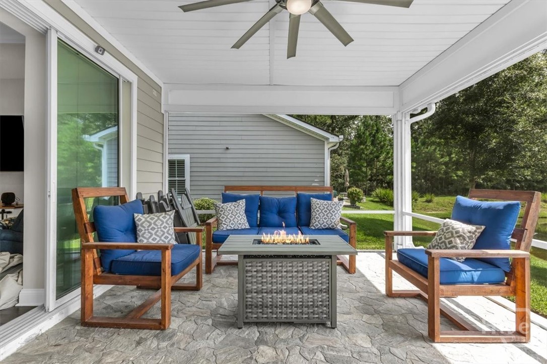 291 McQueen Drive Pooler, GA 31322 - Photo 44 of 57 SCREENED PORCHED WITH STONE FLOORS AND LARGE CEILING FAN