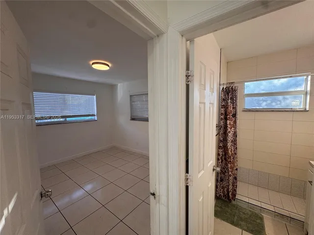 a view of an empty room and window