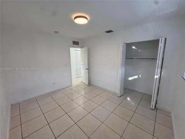 a view of an empty room and window