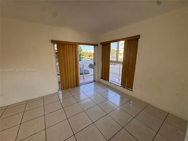a view of an empty room and window