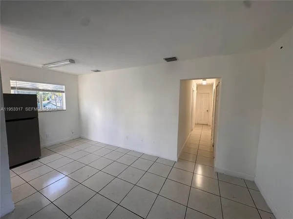 a view of an empty room and window