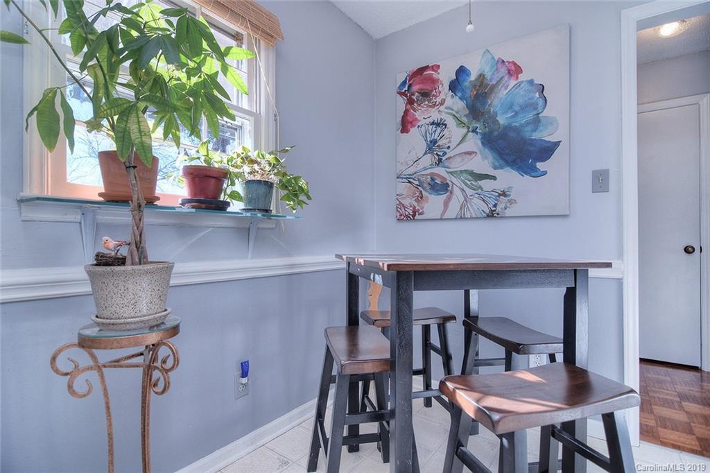 6045 Windjammer Drive Tega Cay, SC 29708 - Photo 13 of 31 a dining room with furniture and a potted plant
