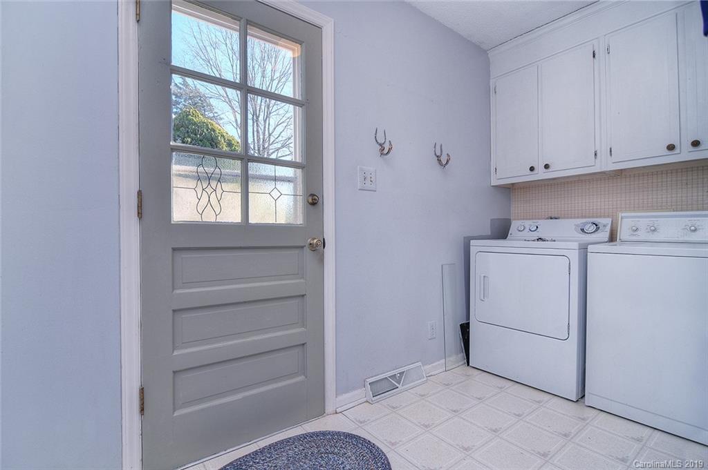 6045 Windjammer Drive Tega Cay, SC 29708 - Photo 14 of 31 a utility room with dryer and washer