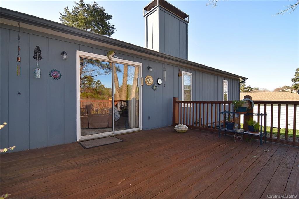 6045 Windjammer Drive Tega Cay, SC 29708 - Photo 24 of 31 a view of a deck with wooden floor and fence