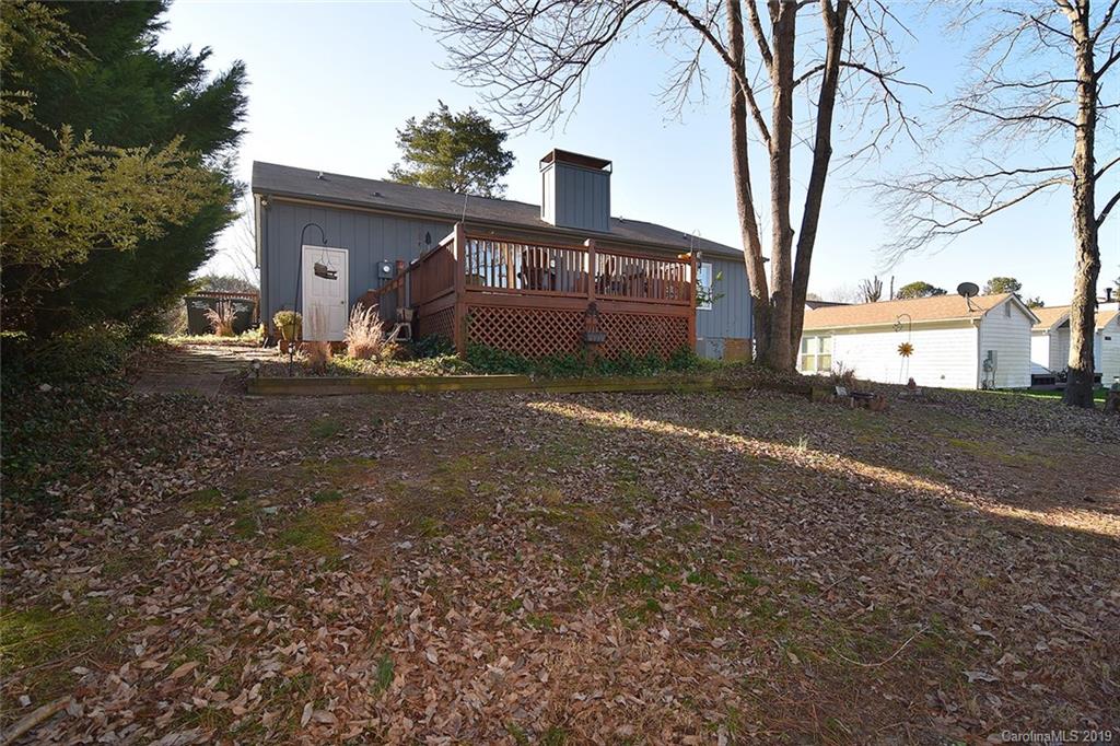 6045 Windjammer Drive Tega Cay, SC 29708 - Photo 28 of 31 a front view of a house with yard and trees