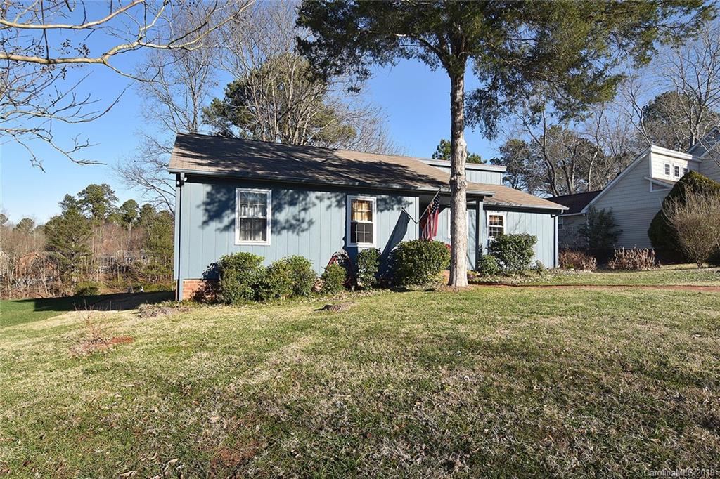 6045 Windjammer Drive Tega Cay, SC 29708 - Photo 30 of 31 a view of a house with a yard