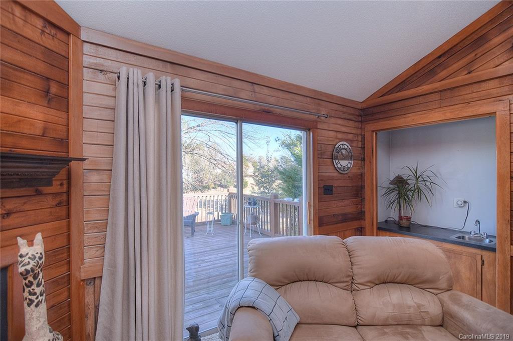 6045 Windjammer Drive Tega Cay, SC 29708 - Photo 7 of 31 a living room with furniture and a large window