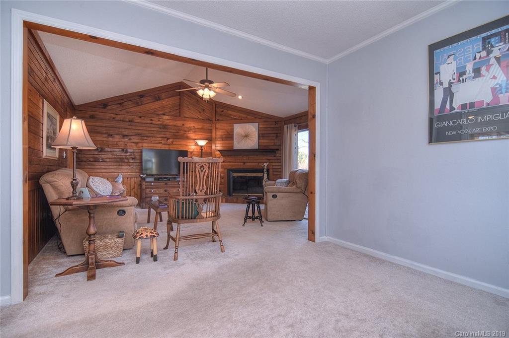6045 Windjammer Drive Tega Cay, SC 29708 - Photo 9 of 31 a view of a livingroom with furniture and a fireplace