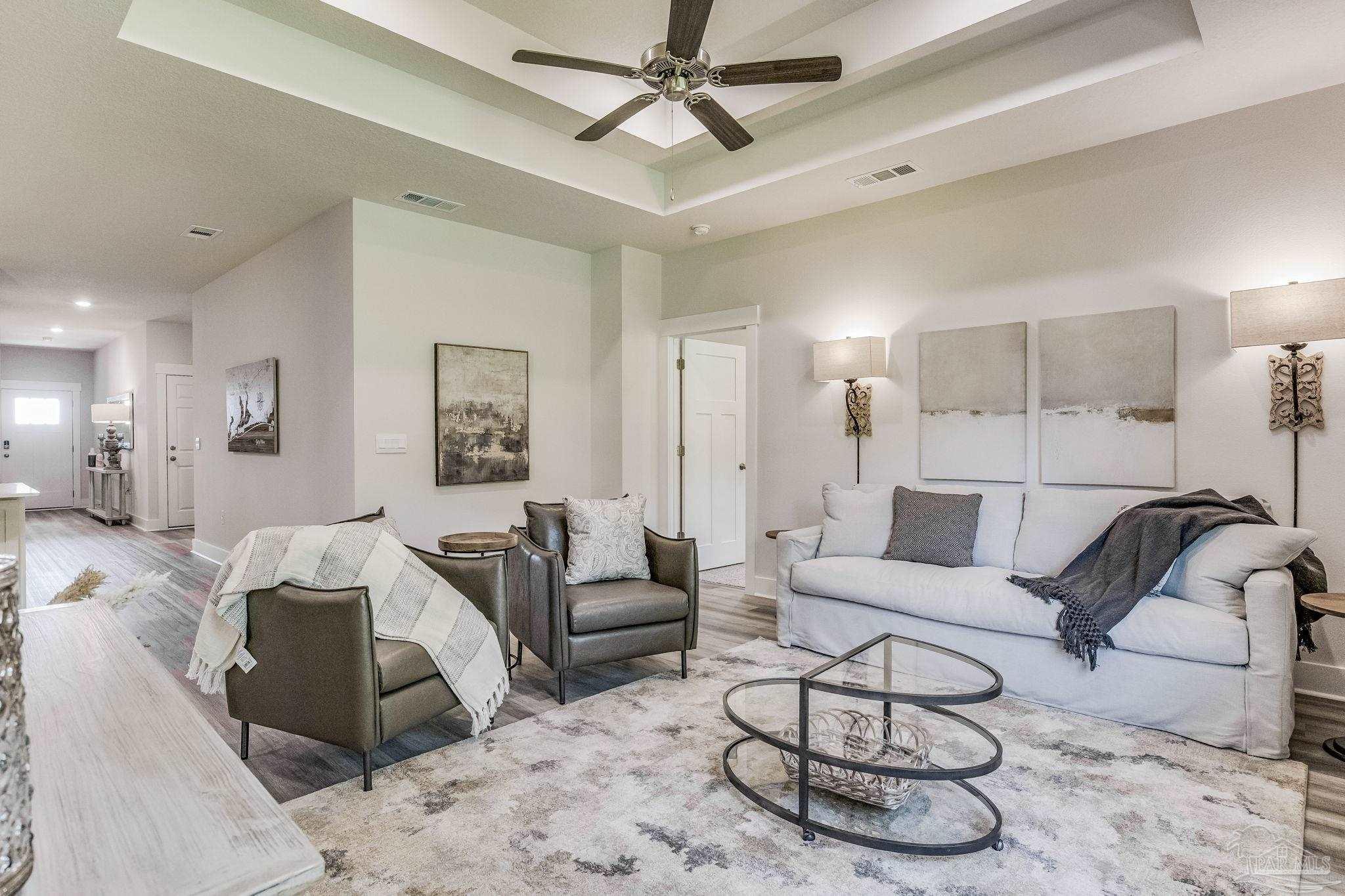 2490 Old Chemstrand Road Cantonment, FL 32533 - Photo 11 of 25 a living room with furniture and a ceiling fan
