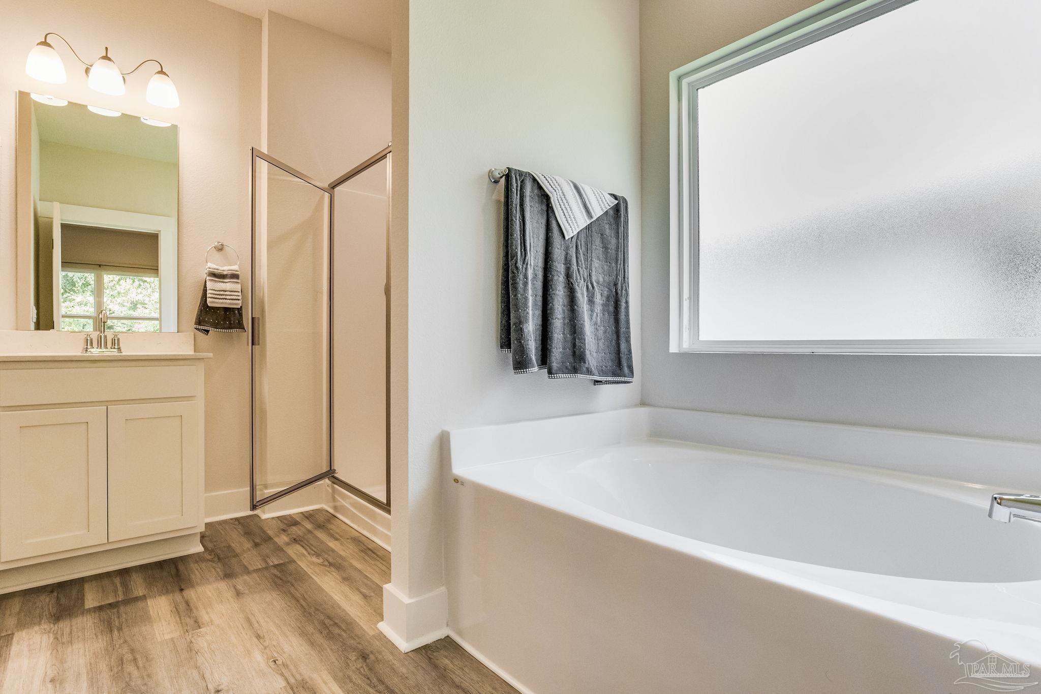 2490 Old Chemstrand Road Cantonment, FL 32533 - Photo 15 of 25 a bathroom with a tub and a sink