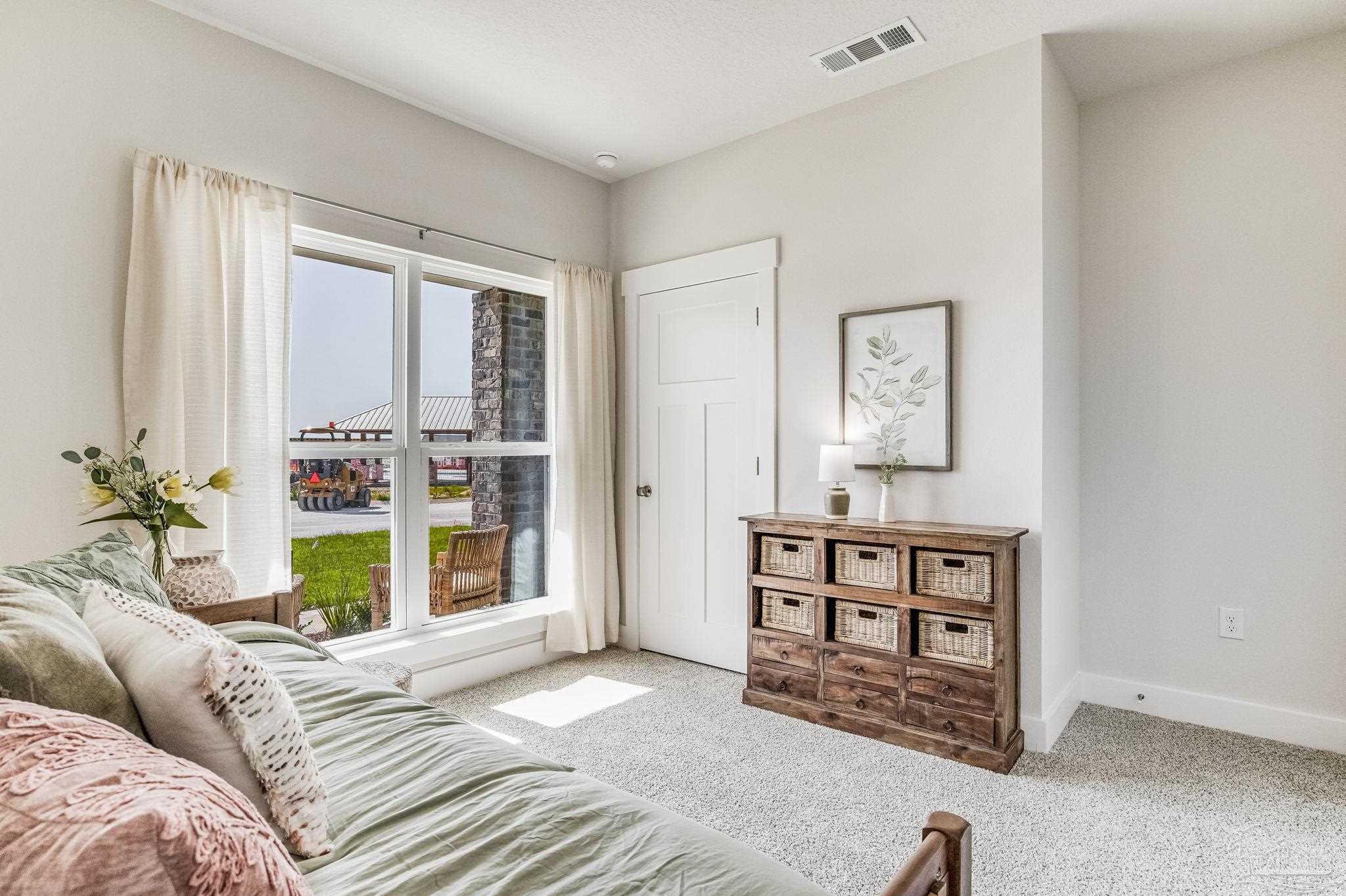 2490 Old Chemstrand Road Cantonment, FL 32533 - Photo 19 of 25 a bedroom with a bed and a window