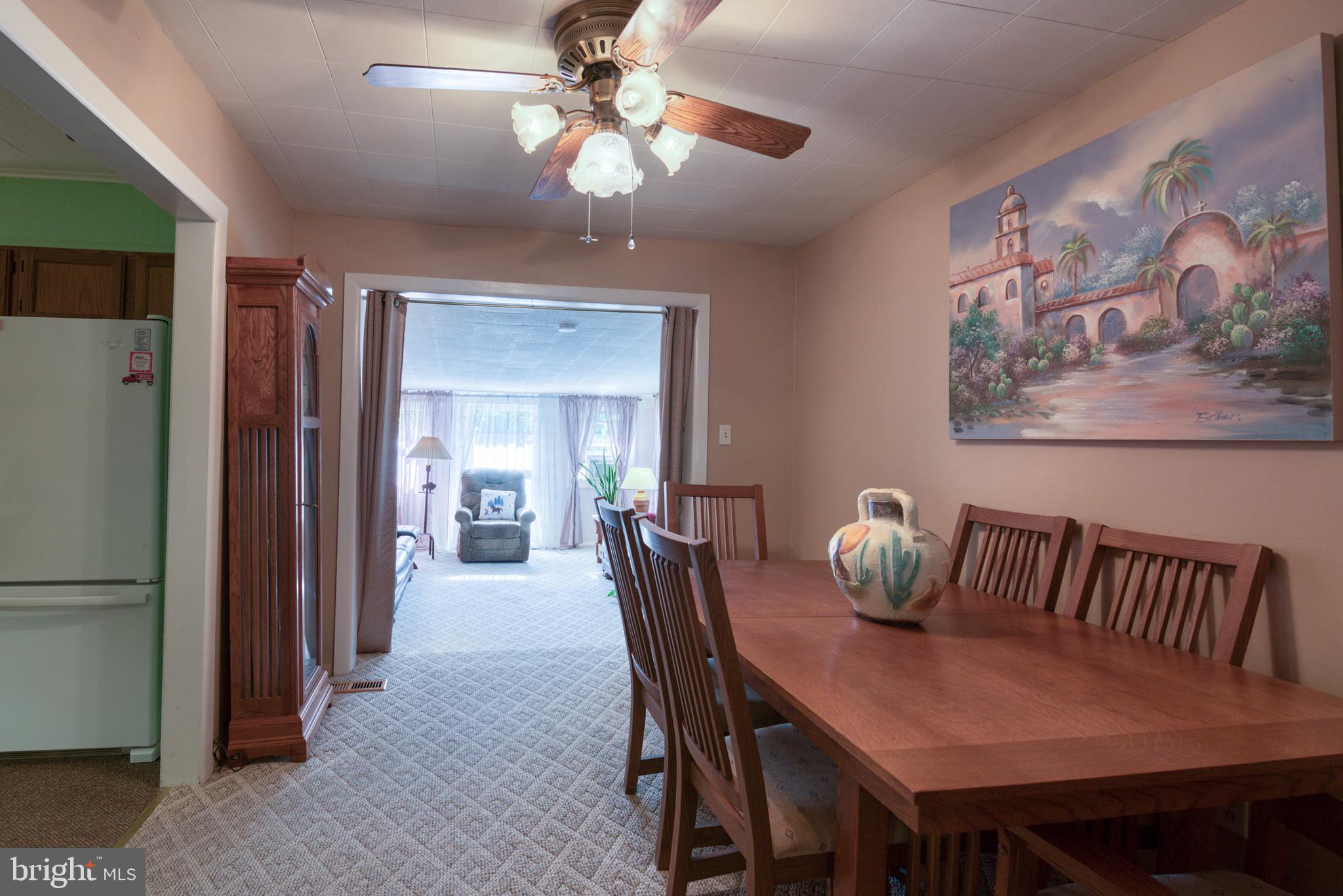 296 Berlin - Cross Keys Road Berlin, NJ 08009 - Photo 11 of 71 a view of a dining room with furniture and a chandelier fan