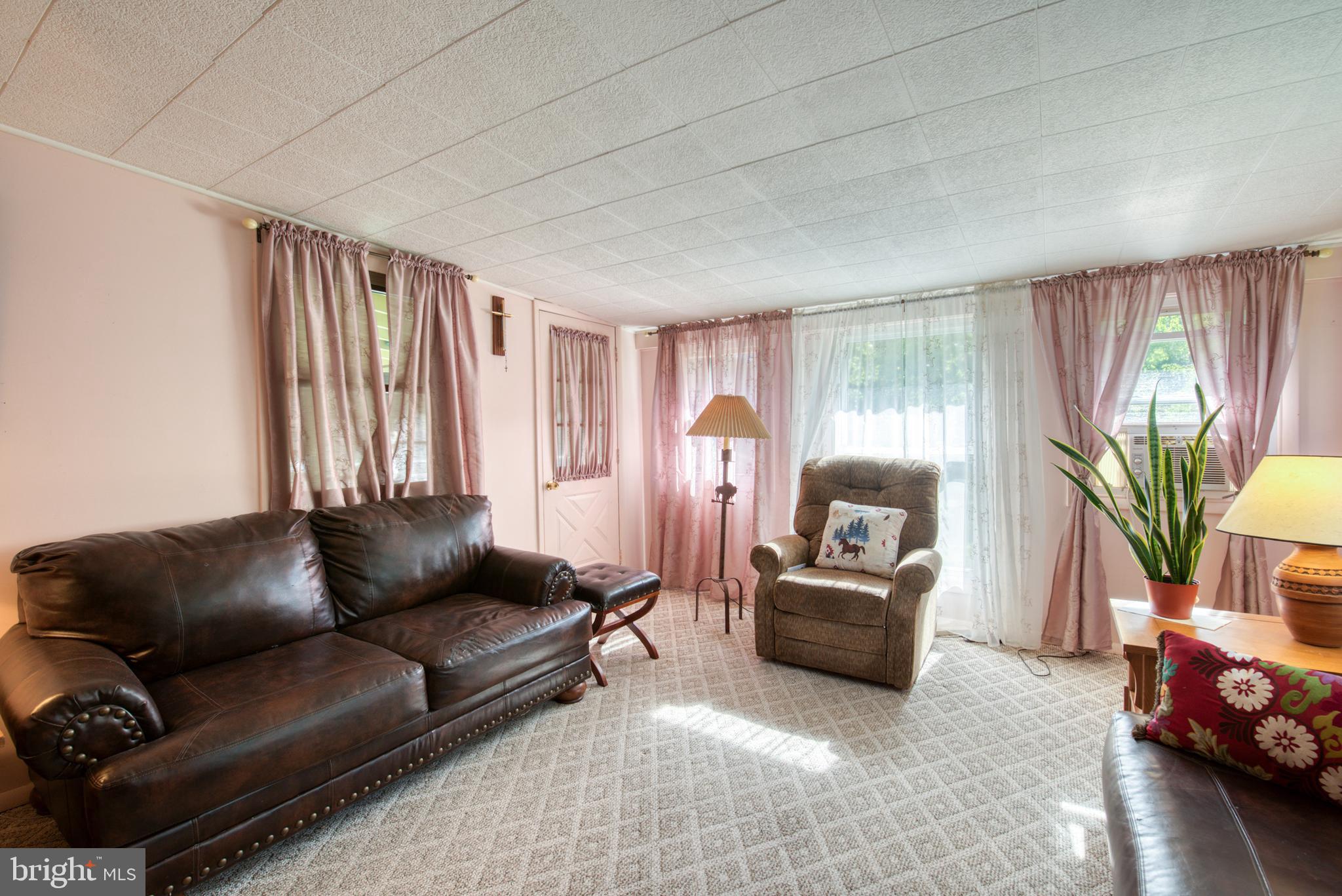 296 Berlin - Cross Keys Road Berlin, NJ 08009 - Photo 14 of 71 a living room with furniture and a large window