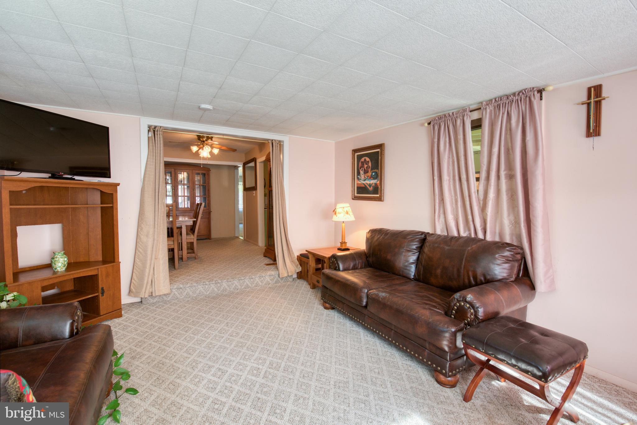 296 Berlin - Cross Keys Road Berlin, NJ 08009 - Photo 16 of 71 a living room with furniture and a flat screen tv