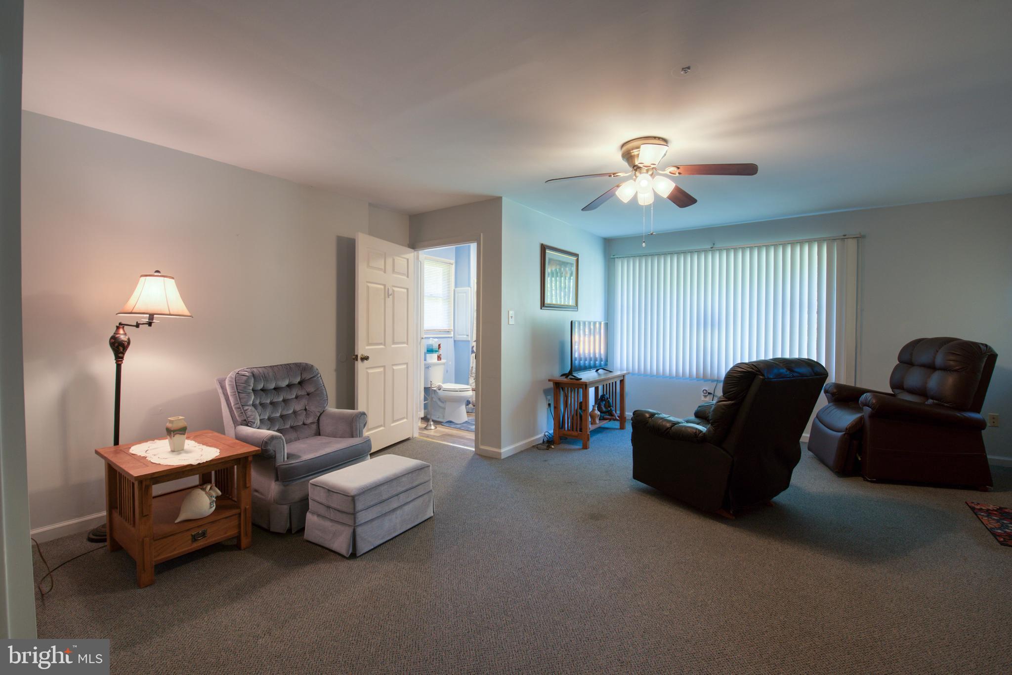296 Berlin - Cross Keys Road Berlin, NJ 08009 - Photo 18 of 71 a living room with furniture a lamp and a window