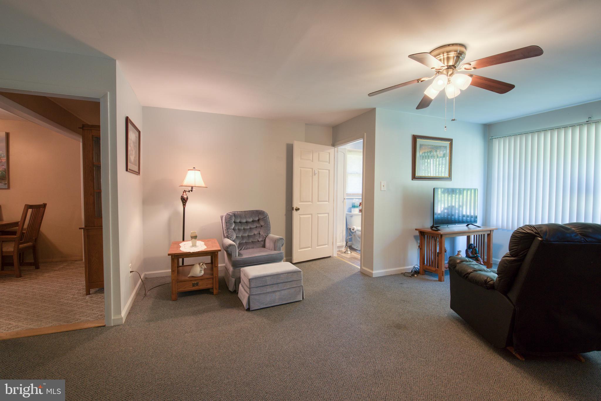 296 Berlin - Cross Keys Road Berlin, NJ 08009 - Photo 19 of 71 a living room with furniture and a chandelier