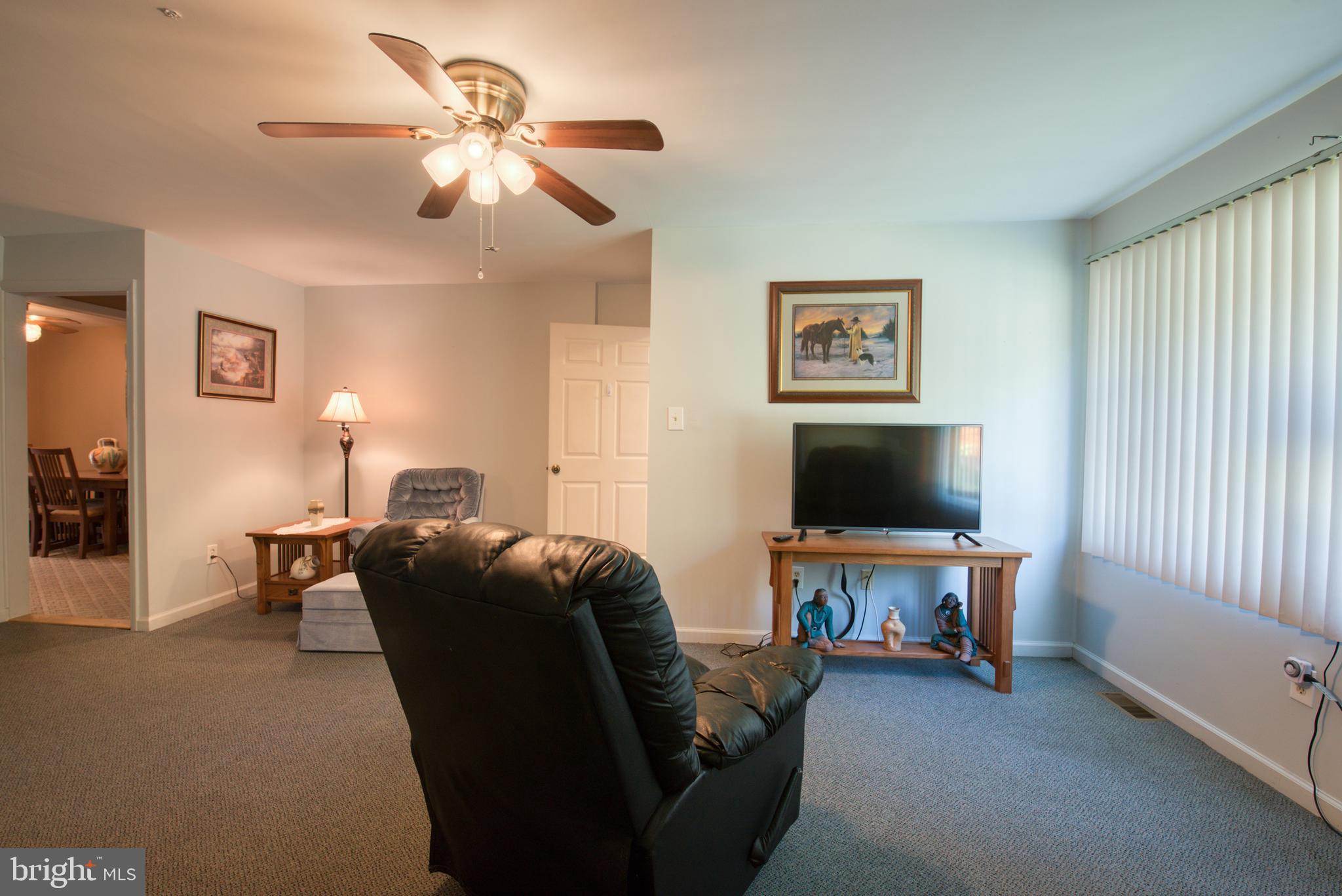 296 Berlin - Cross Keys Road Berlin, NJ 08009 - Photo 20 of 71 a living room with furniture and a flat screen tv