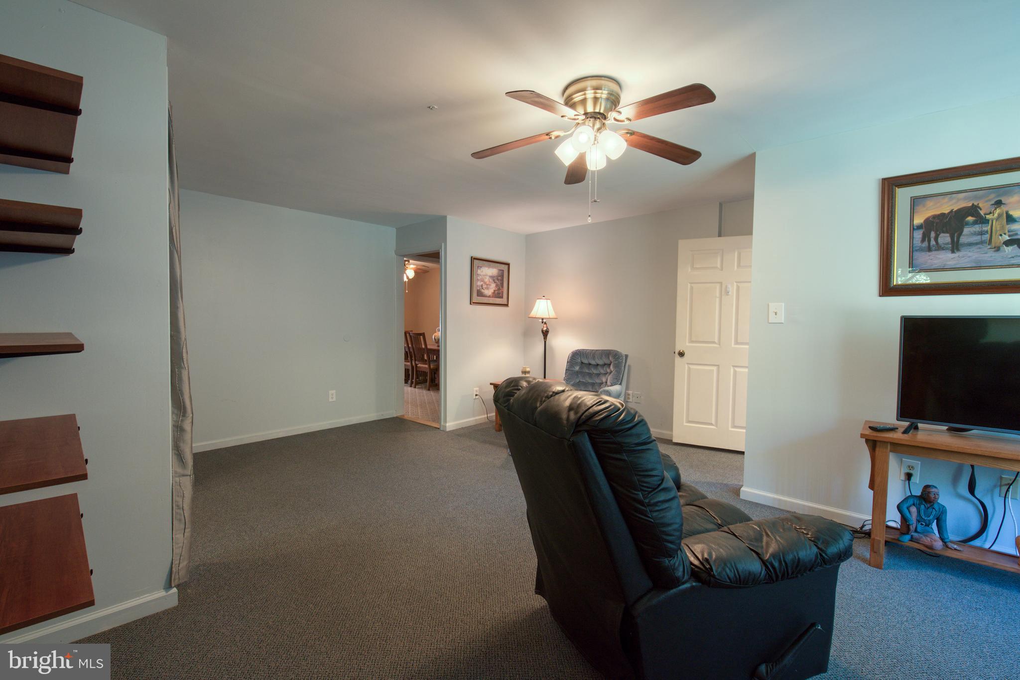 296 Berlin - Cross Keys Road Berlin, NJ 08009 - Photo 21 of 71 a living room with furniture and a flat screen tv