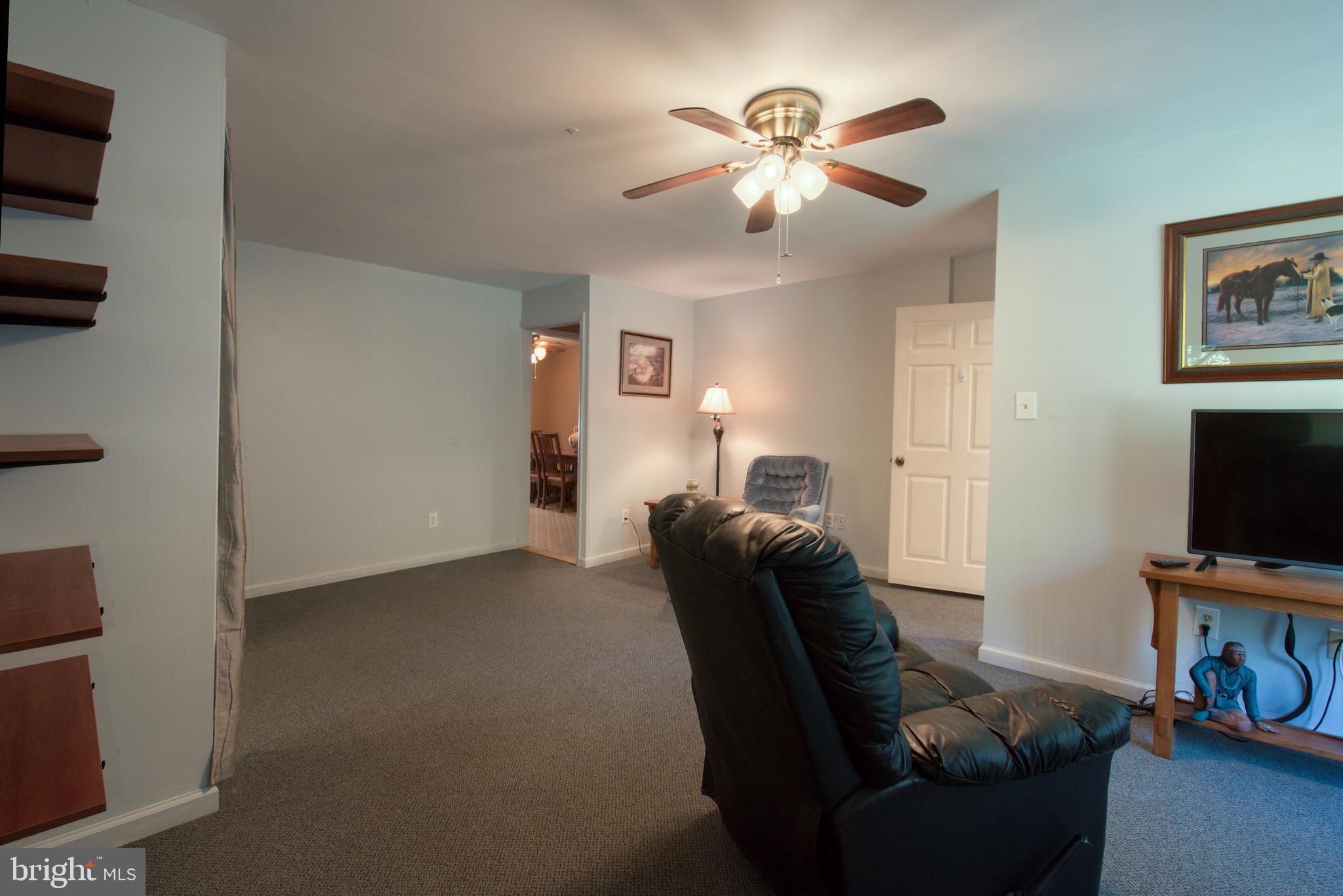 296 Berlin - Cross Keys Road Berlin, NJ 08009 - Photo 22 of 71 a living room with furniture and a flat screen tv