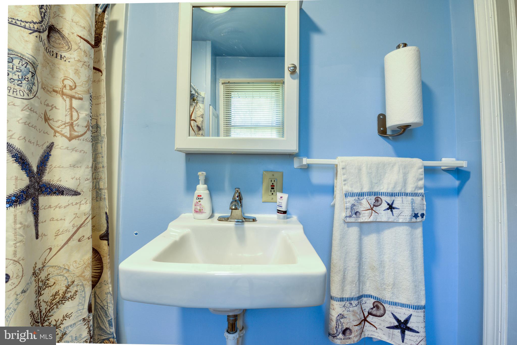 296 Berlin - Cross Keys Road Berlin, NJ 08009 - Photo 27 of 71 a bathroom with a sink and a mirror