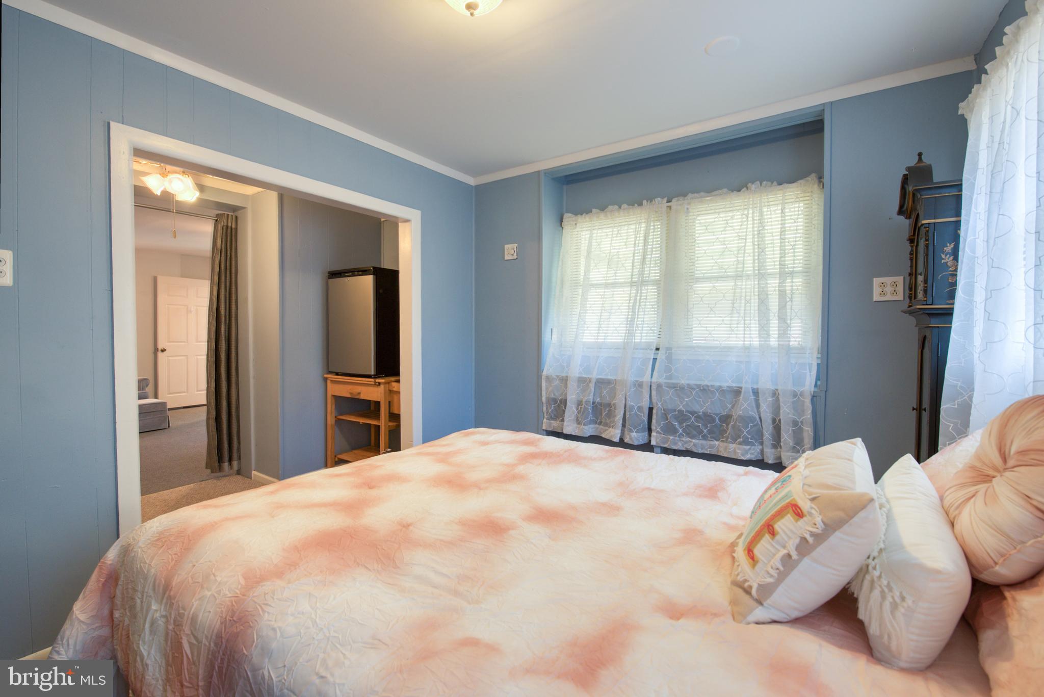 296 Berlin - Cross Keys Road Berlin, NJ 08009 - Photo 32 of 71 a large bed sitting in a bedroom next to a window