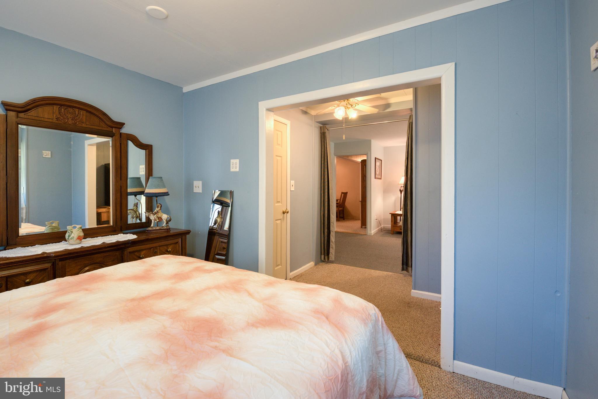 296 Berlin - Cross Keys Road Berlin, NJ 08009 - Photo 33 of 71 a bedroom with a bed and a large mirror