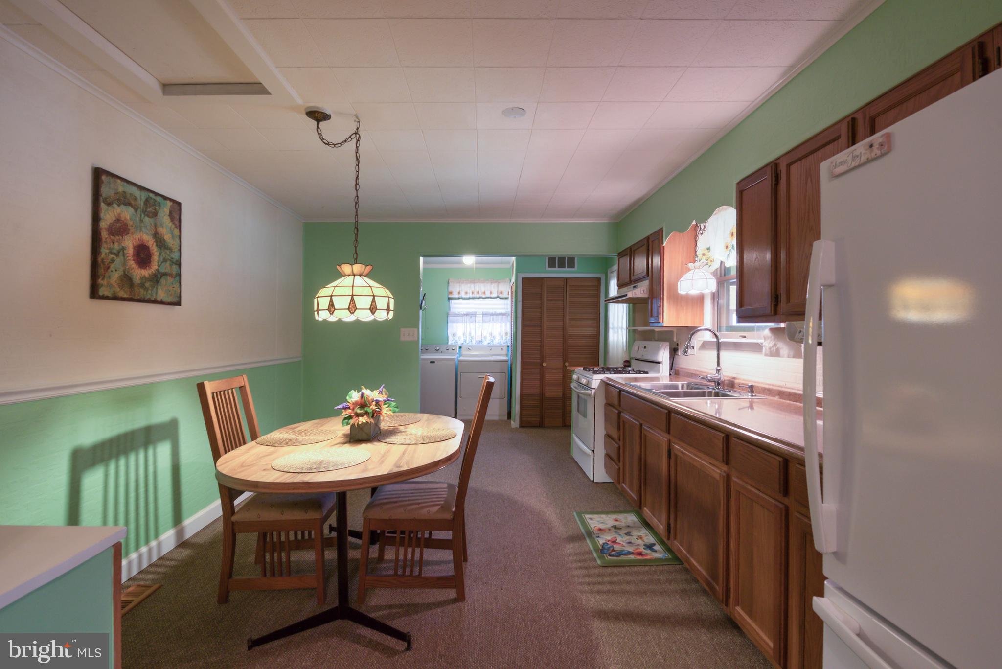 296 Berlin - Cross Keys Road Berlin, NJ 08009 - Photo 6 of 71 a dining room with furniture a rug and a chandelier