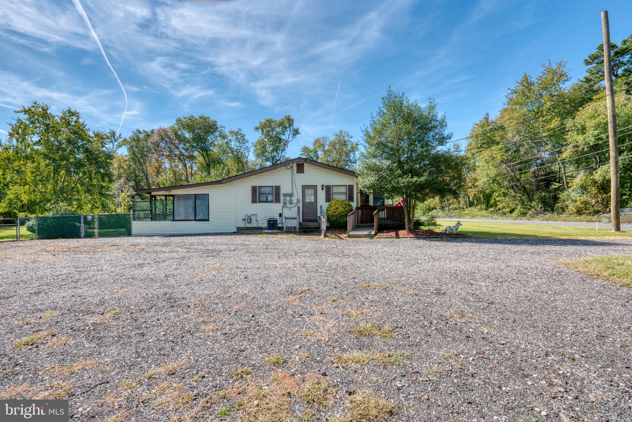 296 Berlin - Cross Keys Road Berlin, NJ 08009 - Photo 67 of 71 a front view of a house with a yard and trees