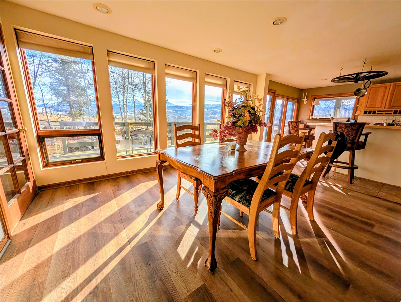 1703 Elk Run Road Silverthorne, CO 80498 - Photo 11 of 46 a dining room with furniture and wooden floor
