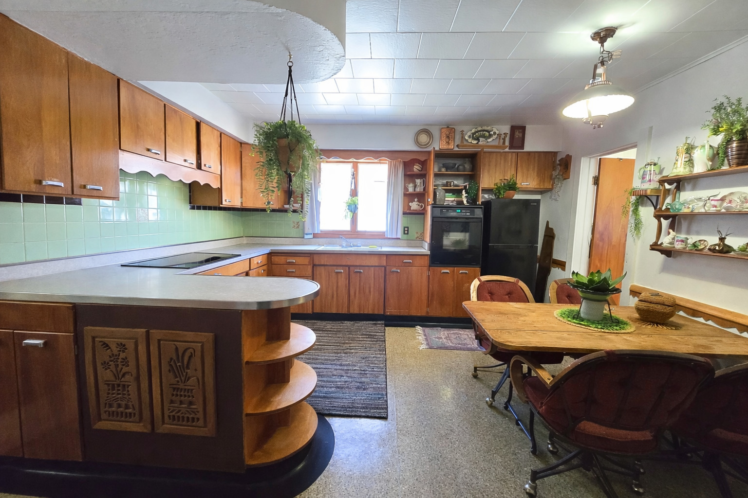628 3rd Avenue South Clinton, IA 52732 - Photo 11 of 23 a kitchen with a sink cabinets and dining table