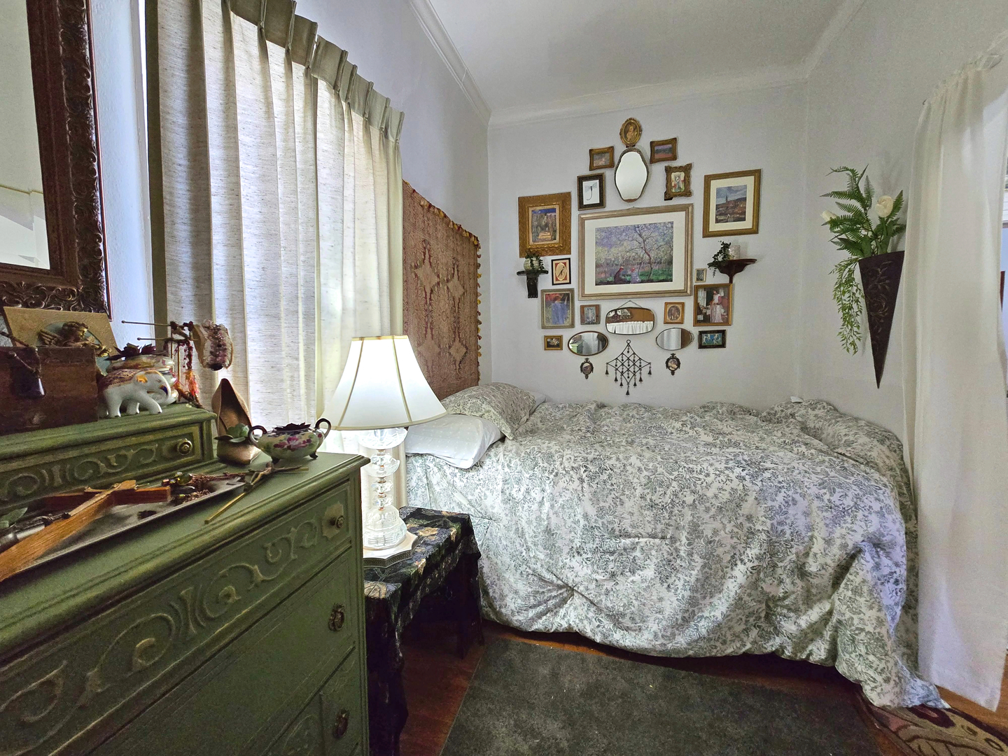 628 3rd Avenue South Clinton, IA 52732 - Photo 16 of 23 a bedroom with a bed and dresser with mirror