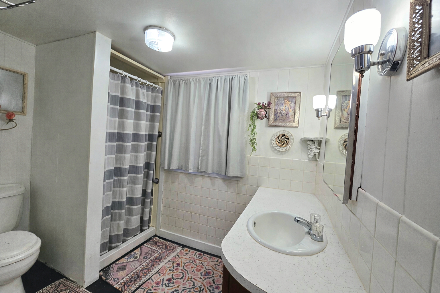 628 3rd Avenue South Clinton, IA 52732 - Photo 19 of 23 a bathroom with a sink toilet and shower