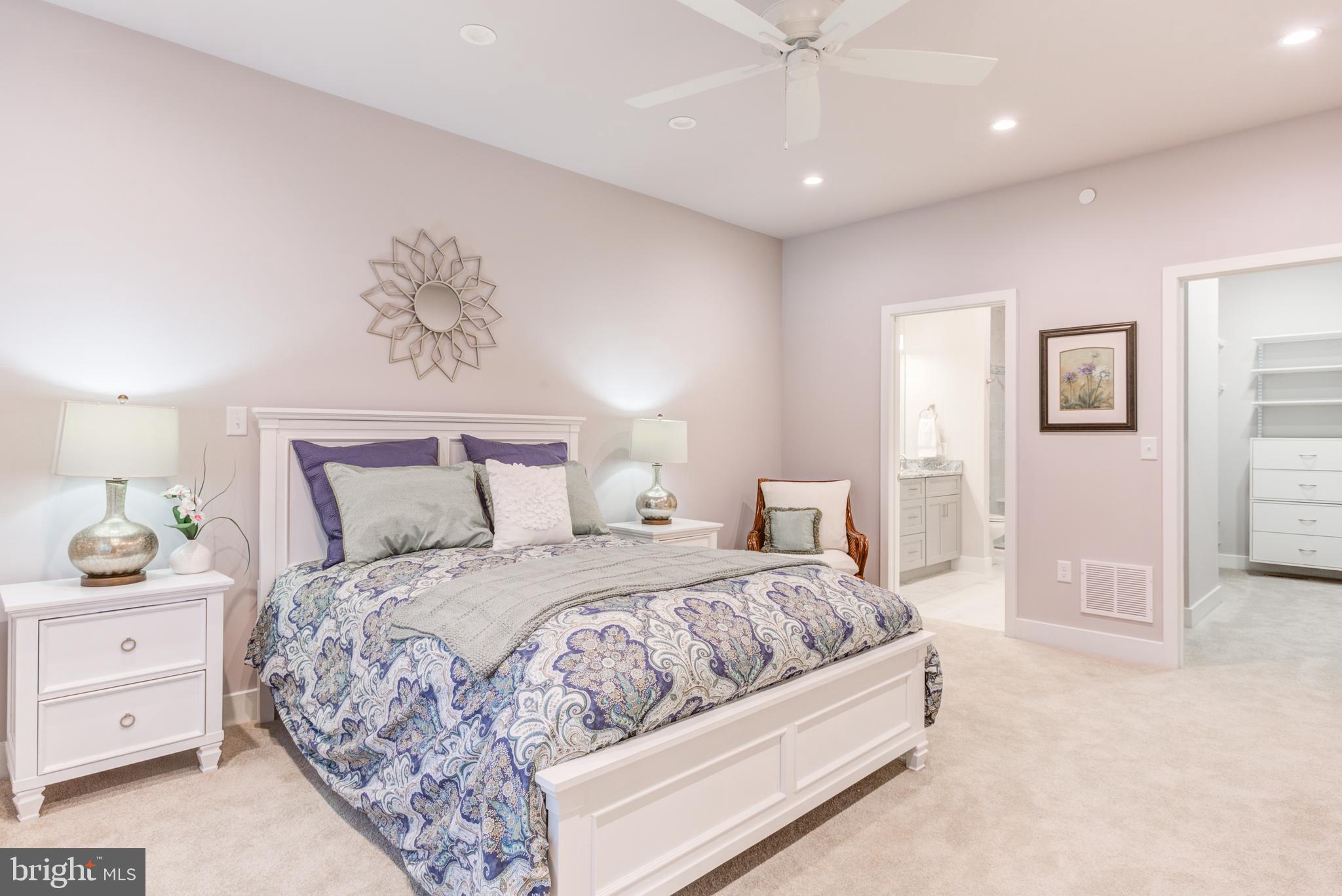 4337 Heather Lane, Unit 41 Columbia, PA 17512 - Photo 8 of 16 a bedroom with a large bed and a chandelier