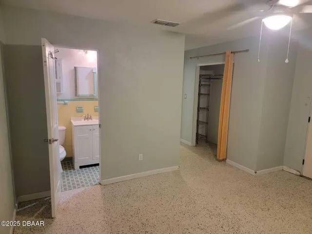 a view of a room with a bathroom