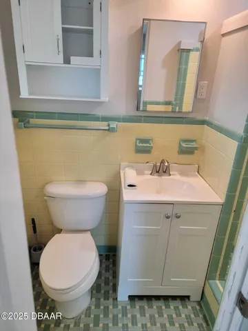 a bathroom with a toilet and a sink